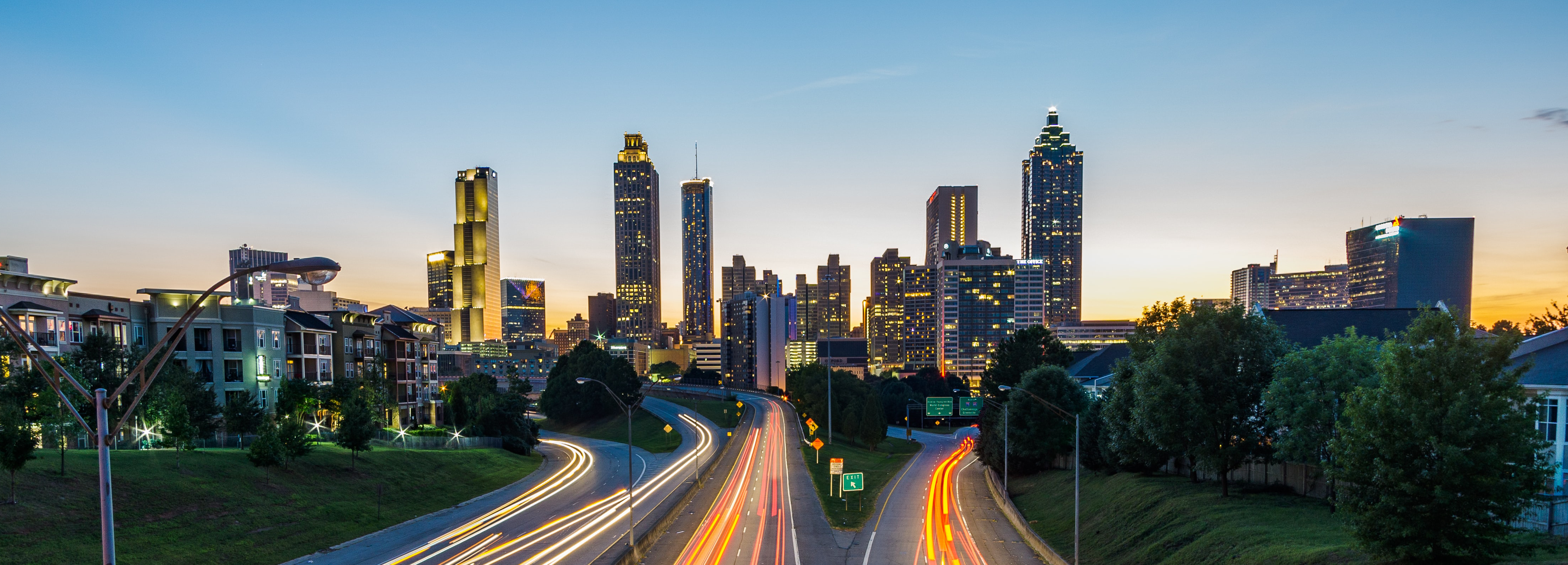 A timelapse view of highways at sunset against the Atlanta skyline.